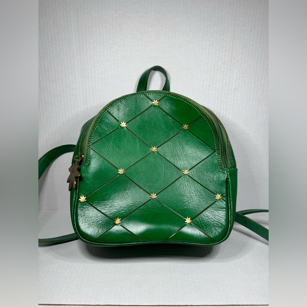 Chicana Dirtbag green leather backpack with metal leaves